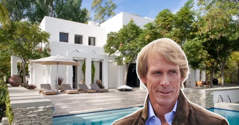 Aerial view of the Michael Bay House showcasing its modern design, expansive glass walls, and scenic outdoor pool area.