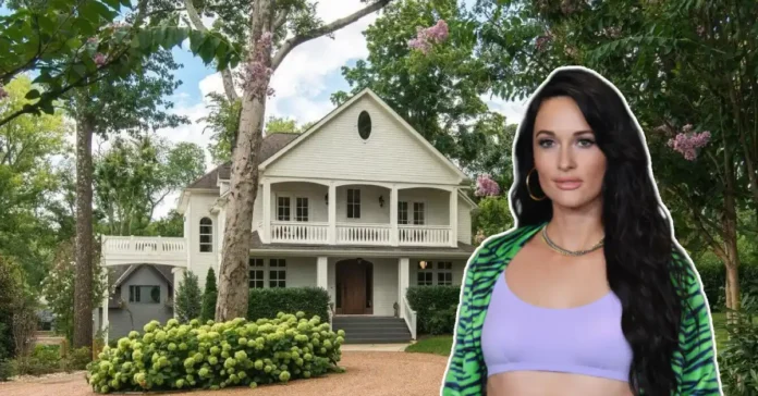 Kacey Musgraves House exterior showing white colonial Nashville home with wraparound porch and lush landscaping where the Grammy winner created her minimalist sanctuaryRetryClaude can make mistakes. Please double-check responses.