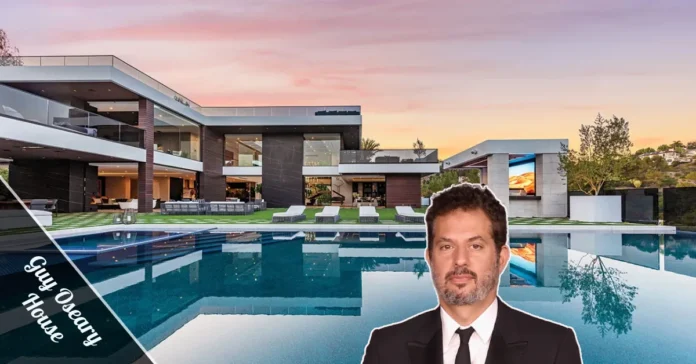 Guy Oseary House — Beverly Hills luxury estate with modern glass design, swimming pool, and private tennis court.